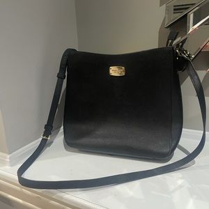 7/10 Micheal Kors side bag! Has some damages which I provided pictures of.